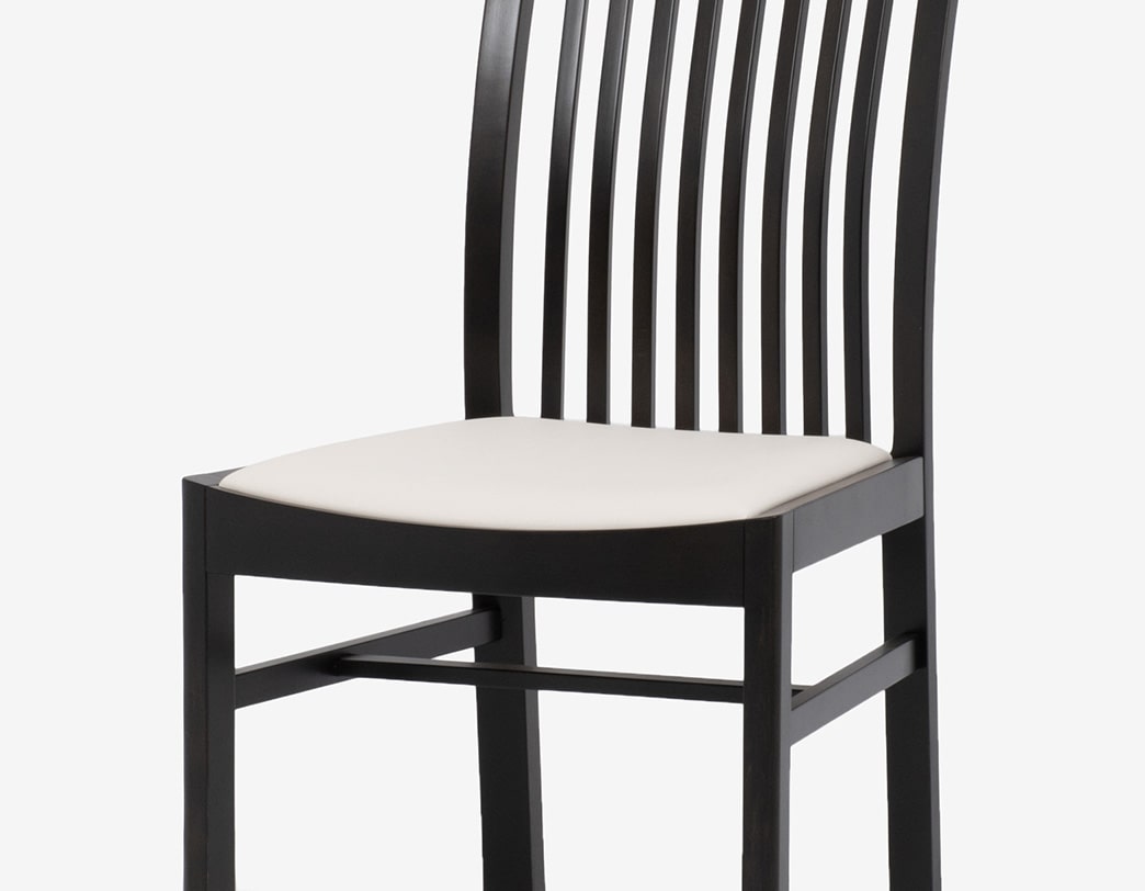 Modern dining chair with impressive curves designed by Isamu Kenmochi