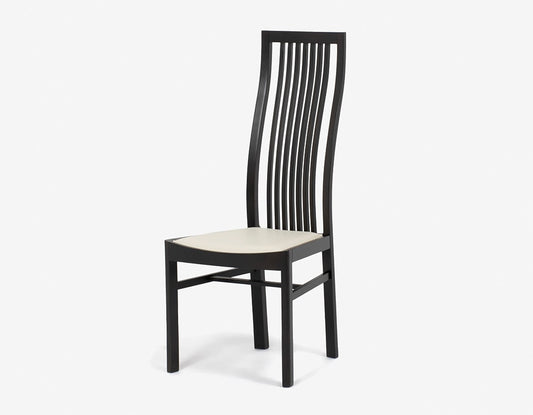 Modern dining chair with impressive curves designed by Isamu Kenmochi