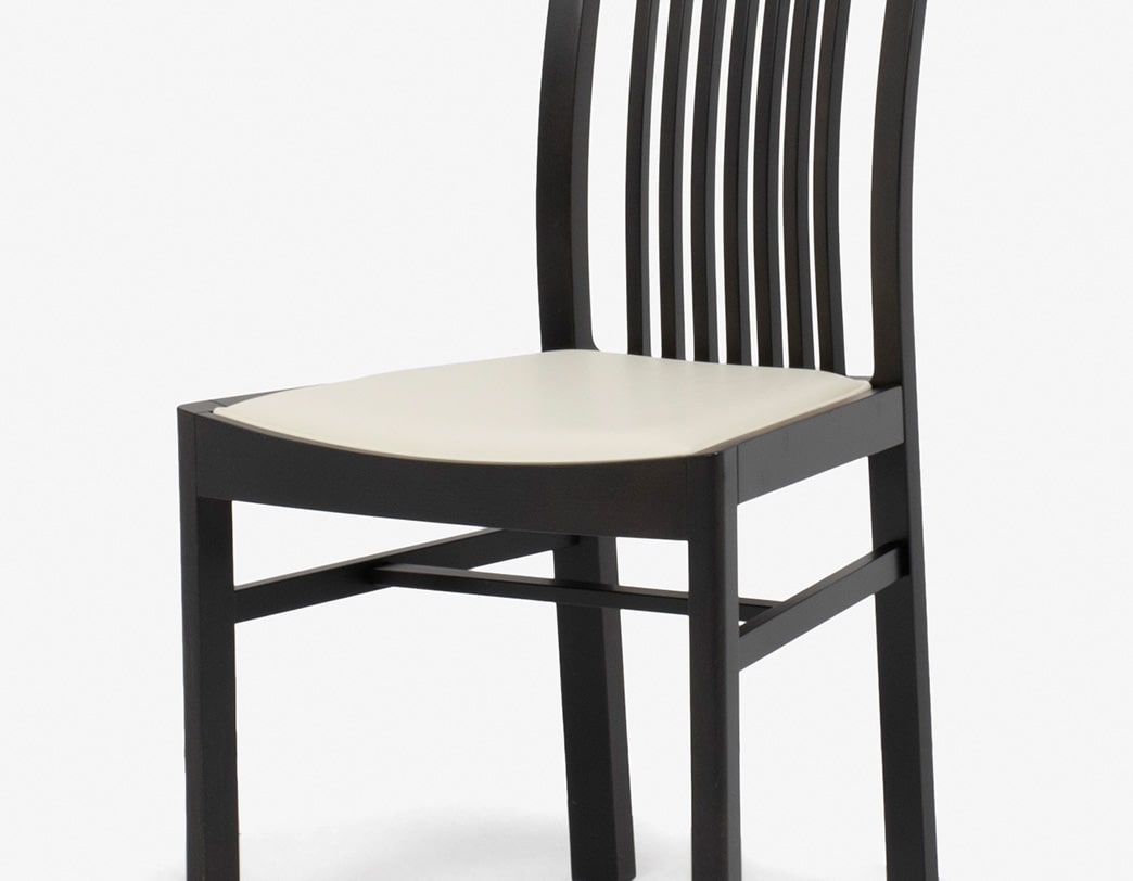 Modern dining chair with impressive curves designed by Isamu Kenmochi