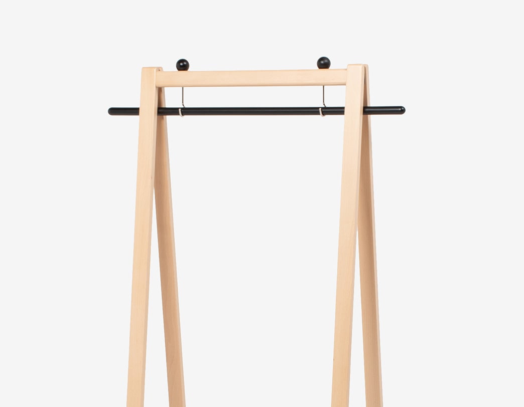 Foldable wooden hanger rack with leather-accented belt