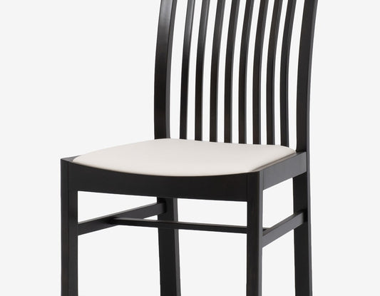 Modern dining chair with impressive curves designed by Isamu Kenmochi