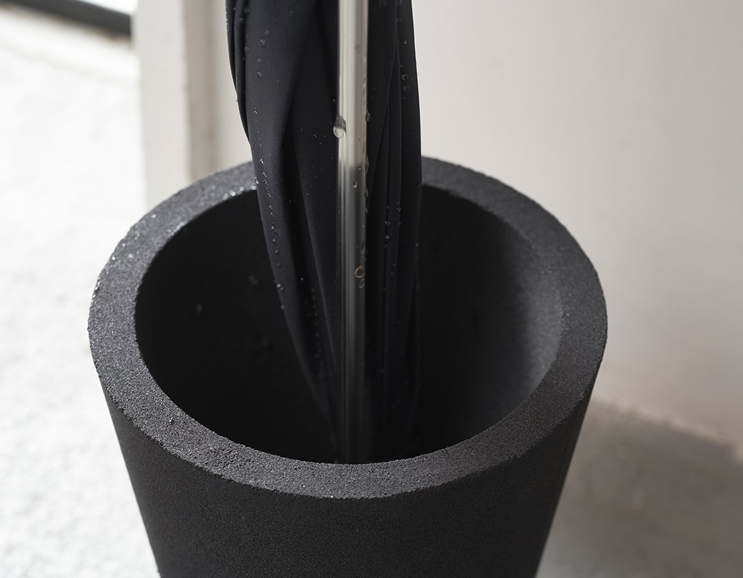 Sustainable umbrella stand made of stainless steel and recycled resin